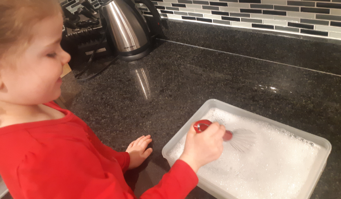 Photo - child whisking bubbles