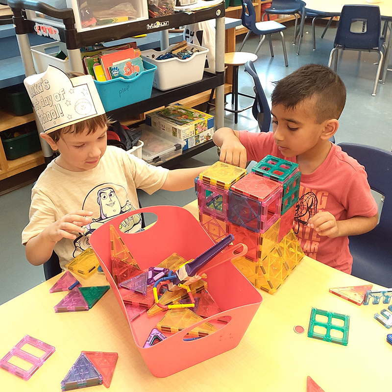 Two kindergarten boys build with blocks in a PLASP kindergarten program