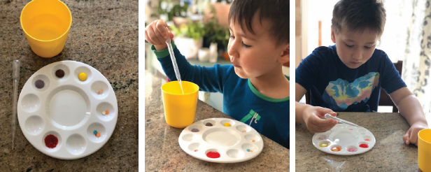 Children adding water to various coloured objects on a paint palette